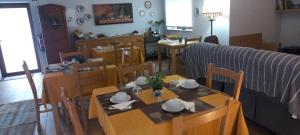 a dining room with a table and chairs at Quinta do Cadaval in Cortiçô