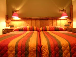 Postel nebo postele na pokoji v ubytování Hostal Xaloa Orio