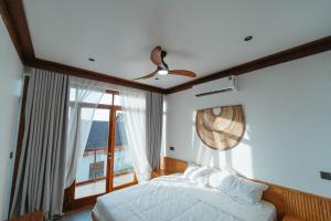 Ένα ή περισσότερα κρεβάτια σε δωμάτιο στο The Zanzibar Villa at Emerald Paje