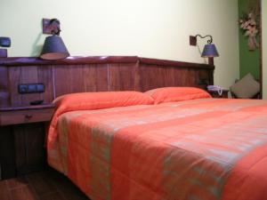Postel nebo postele na pokoji v ubytování Hostal Xaloa Orio