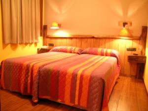 Postel nebo postele na pokoji v ubytování Hostal Xaloa Orio