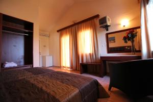 Ένα ή περισσότερα κρεβάτια σε δωμάτιο στο Belvedere Aeolis Hotel 
