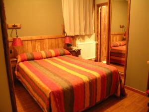 Postel nebo postele na pokoji v ubytování Hostal Xaloa Orio