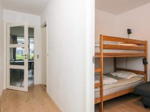 En eller flere senge i et værelse på 6 person holiday home in Ringkøbing