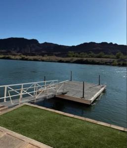 a dock in the middle of a body of water at Cliff Hanger, River access with dock in Parker