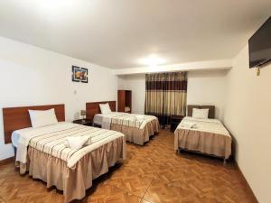 Postel nebo postele na pokoji v ubytování Hotel El Gran Patriarca