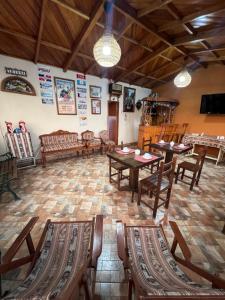 a dining room with wooden tables and chairs at Lima Airport Tampu in Lima