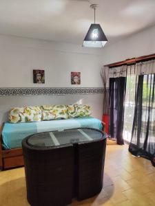 En eller flere senge i et værelse på Edificio Maracuja - Departamentos