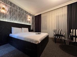 Postel nebo postele na pokoji v ubytování 716 Pendik Suit OTEL