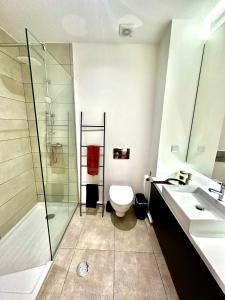 a bathroom with a shower and a toilet and a sink at Reis Magos Ocean View in Caniço +20 photos