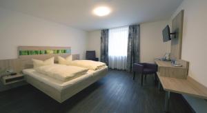 Postel nebo postele na pokoji v ubytování Hotel zur Pfalz