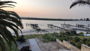 a view of a body of water with a dock at Driftwater in Velddrif