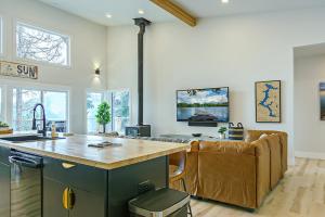 a kitchen and living room with a counter and a couch at Stunning 3BR with Lake Access Golf Cart 11 guests in Worley