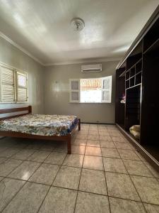 Ένα ή περισσότερα κρεβάτια σε δωμάτιο στο Casa Iguape