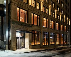 a building on a city street at night at Fidelity Hotel in Cleveland