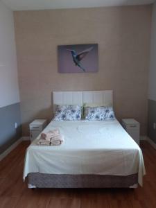 Postel nebo postele na pokoji v ubytování Maranata Suítes