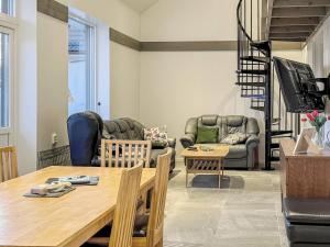 a living room with a table and chairs at 4 star holiday home in Gotlands Tofta in Tofta