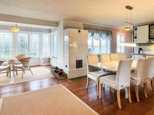 a kitchen and dining room with a table and chairs at 4 star holiday home in Farjestaden in Färjestaden