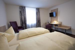 Postel nebo postele na pokoji v ubytování Hotel zur Pfalz
