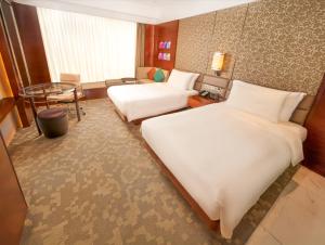 Voodi või voodid majutusasutuse Crowne Plaza Macau by IHG toas