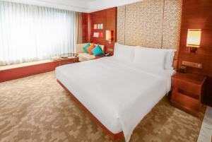 Voodi või voodid majutusasutuse Crowne Plaza Macau by IHG toas