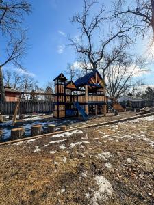 a playground with a slide in a yard at Navi- HUGE yard- MEGA playset- CUTE RV in Willmar