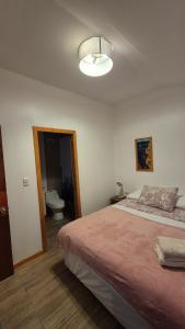 Ένα ή περισσότερα κρεβάτια σε δωμάτιο στο Cabañas Altos del Simpson