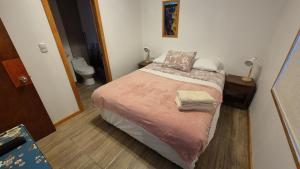 Ένα ή περισσότερα κρεβάτια σε δωμάτιο στο Cabañas Altos del Simpson