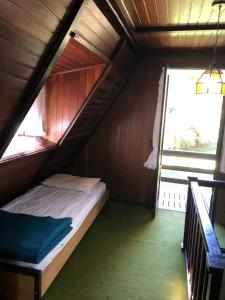 Ένα ή περισσότερα κρεβάτια σε δωμάτιο στο Chalé Nardi