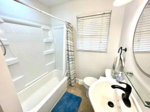 a bathroom with a sink and a toilet and a shower at Large Private Ranch - Master Bedroom Suite with King Bed and private Bathroom - Fenced Yard - Pets & Kids Welcome - Pool Table in Columbus +18 photos