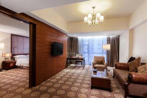 Televiisor ja/või meelelahutuskeskus majutusasutuses Guangzhou Good International Hotel