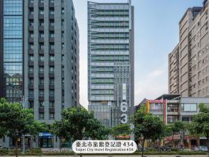 a group of tall buildings in a city at Chaiin Hotel - Dongmen in Taipei