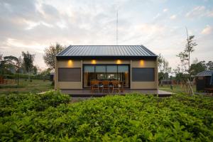 a small house with a black roof at Bobocabin Pangalengan, Bandung in Pengalengan