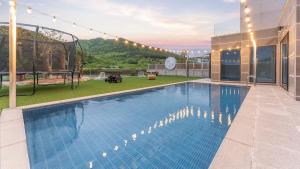 a swimming pool on the roof of a house at Pause Kids Pool Viila in Yeosu