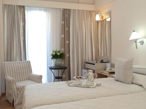 Posteľ alebo postele v izbe v ubytovaní The Park Hotel Piraeus