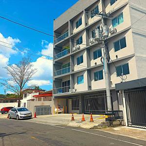 a building with orange traffic cones in front of it at Family Apartment in San Francisco in Panama City
