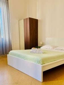 A bed or beds in a room at Mamamia #Politeama