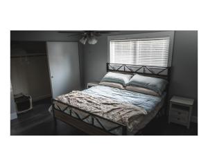 a bedroom with a bed in a room with a window at Pleasant View House in Freeland