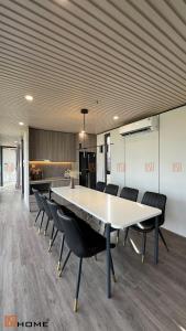 a large dining room with a table and chairs at DSD Resort in Kon Rung (1)