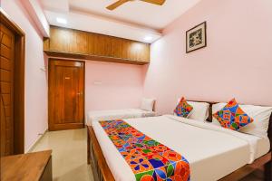Postel nebo postele na pokoji v ubytování Fabhotel Hathvik Park - Near to Nandanam Metro Station + 31 fotografií