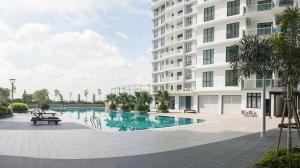 a swimming pool in front of a building at Platino MWMG in Johor Bahru