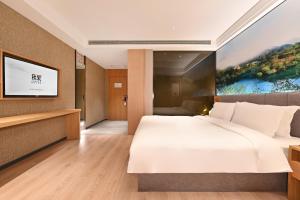 Letto o letti in una camera di 秋果酒店 北京颐和园店