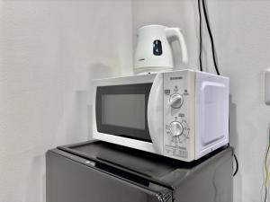 TV a/nebo společenská místnost v ubytování Little Island Okinawa Nago