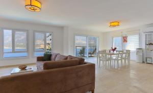 a living room with a couch and a table at Stella Sea View & Access to Sea in Kas