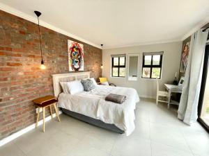 Postel nebo postele na pokoji v ubytování Beachcomber Cottage Springerbaai