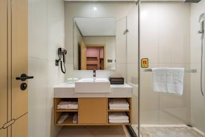 Koupelna v ubytování Tonglu City Center Rosery Hotel