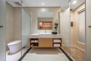 Koupelna v ubytování Tonglu City Center Rosery Hotel