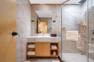 Koupelna v ubytování Tonglu City Center Rosery Hotel