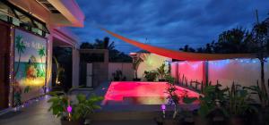a house with a swimming pool at night at Casa Mel Mar Luxurious 3BR 3FullBR Villa with Pool in Panglao