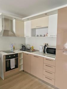 A kitchen or kitchenette at Apartments in complex ATIA RESORT